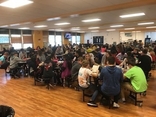 Students at Challand Middle School participate in the free lunch program in the CMS cafeteria.