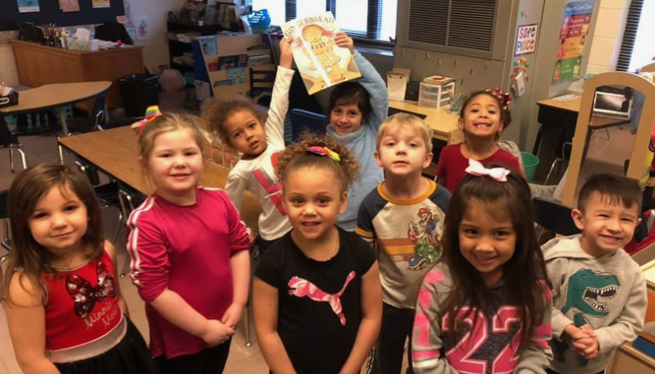 PreSchool students showing their love for literacy!