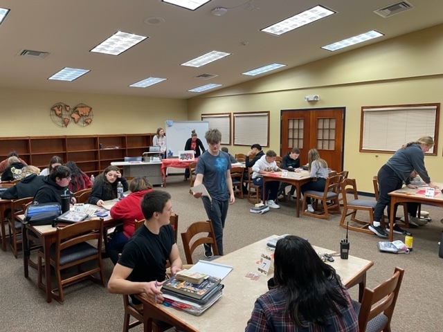Students in Ms. Johnson's English class work with librarian , Heather Johnson,  on a STEAM challenge as they prepare to read Fahrenheit 451! 