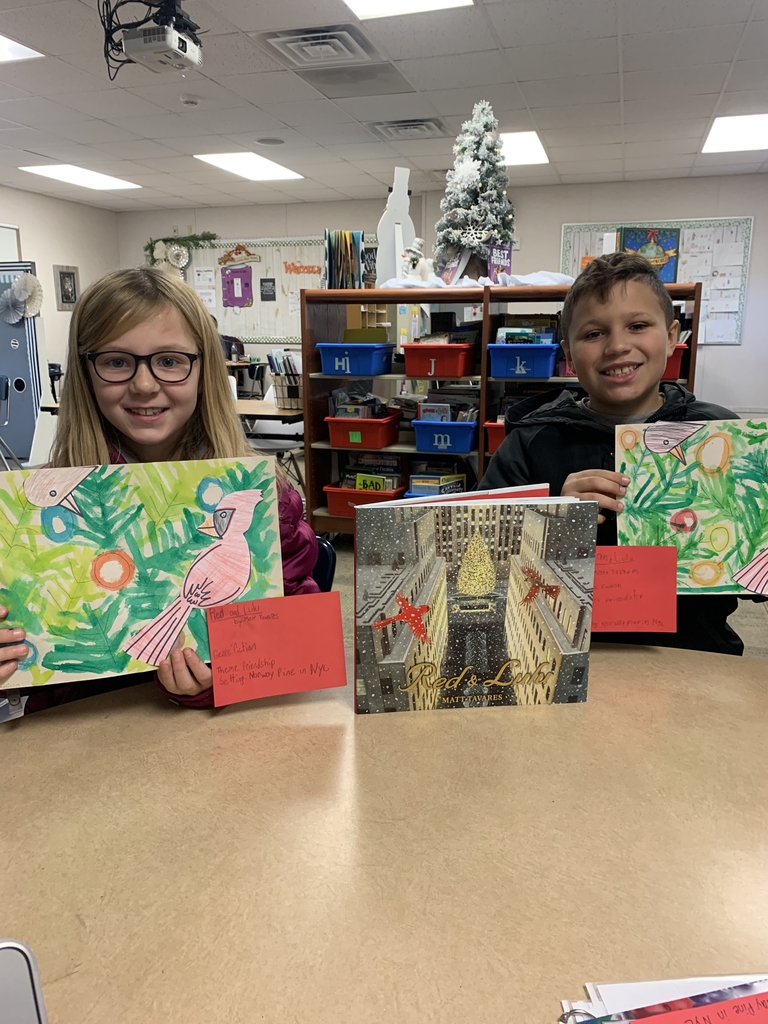 Students showing off paintings